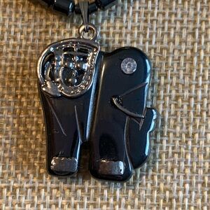 Vintage hematite elephant pendant with trunk up. Sterling barrel clasp.